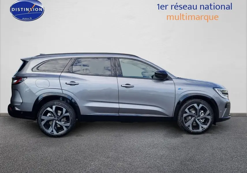 Profil droit du Renault Espace VI gris schiste avec jantes alliage 20 pouces et toit panoramique visible.