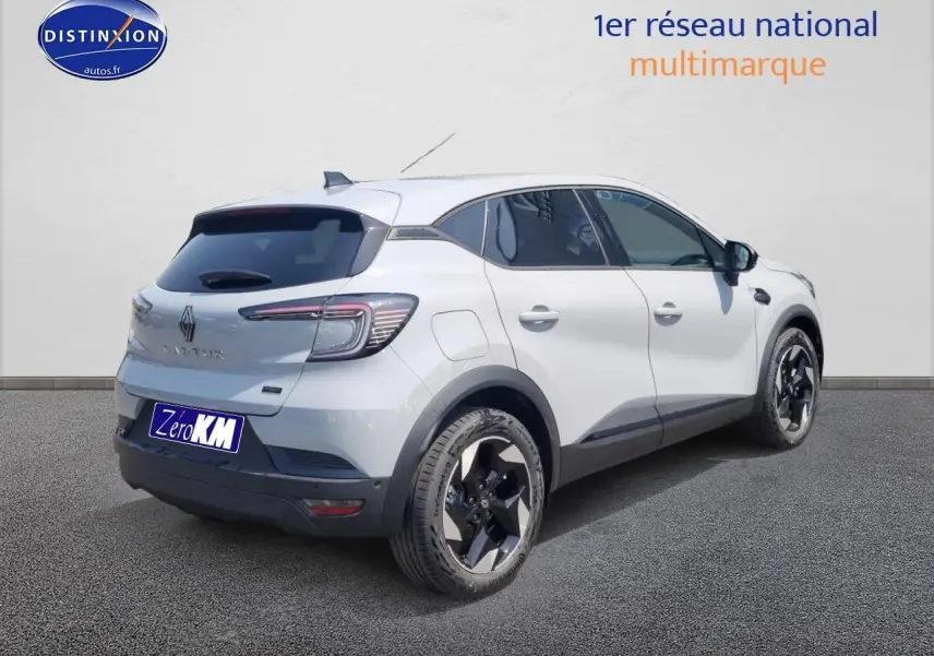 Renault Captur gris rafale vu en 3/4 arrière droit avec jantes alu et toit blanc contrasté