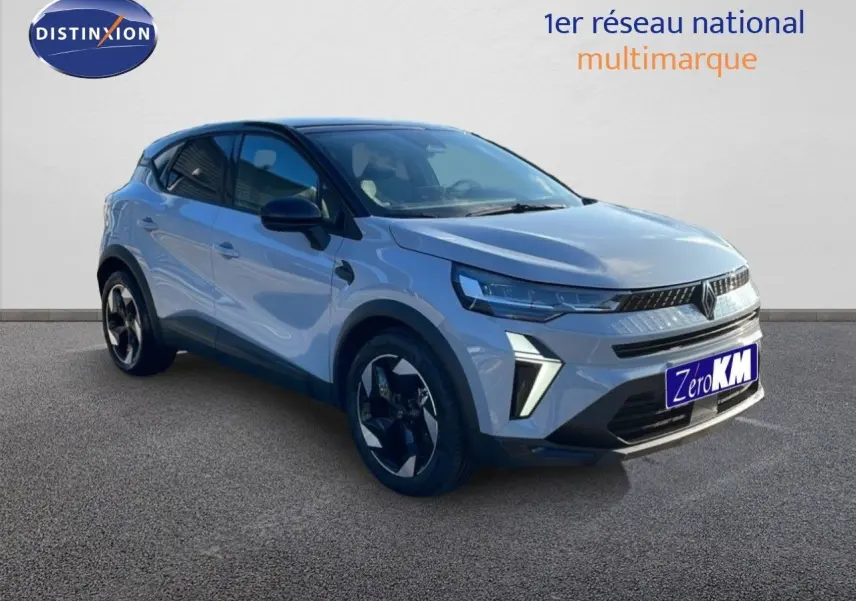 Renault Captur E-Tech hybride gris Rafale métal avec toit noir, vue 3/4 avant droit mettant en valeur ses optiques LED.