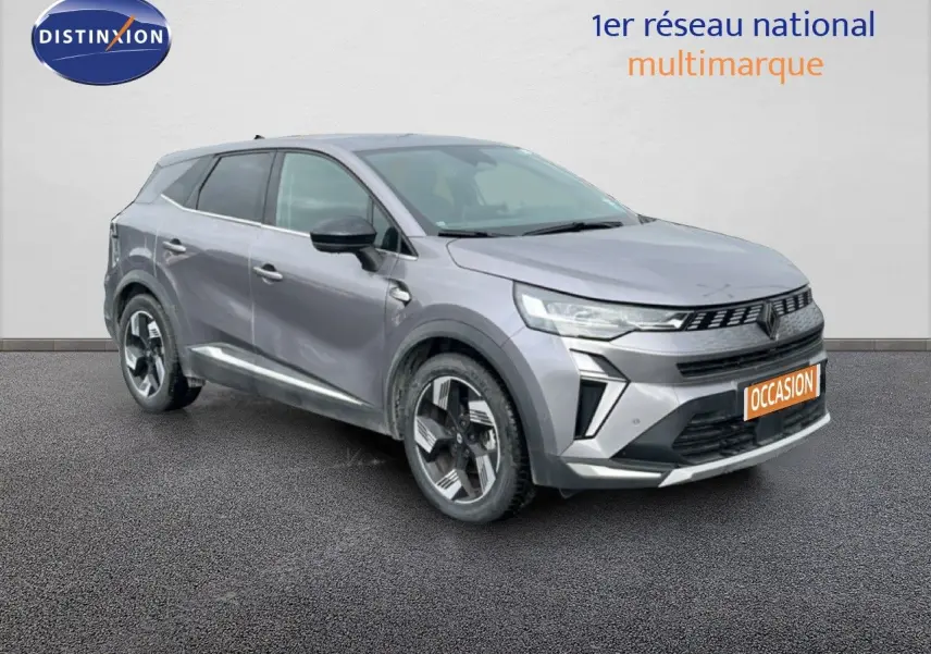 Vue 3/4 avant droit d'un Renault Symbioz 2025 gris cassiopée métal avec calandre moderne et jantes stylisées.