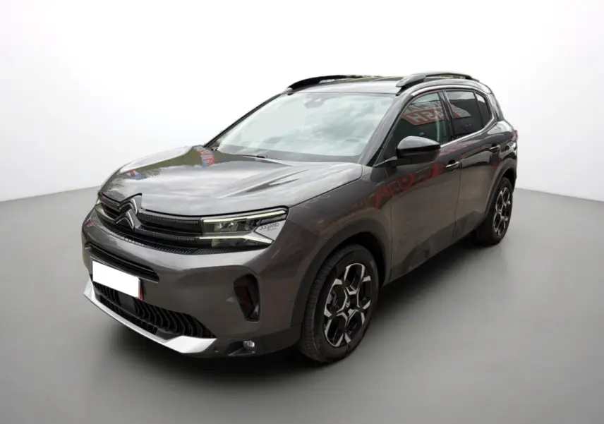 Citroën C5 Aircross Hybrid gris platinium vue 3/4 avant droit avec barres de toit et jantes alu 18 pouces.