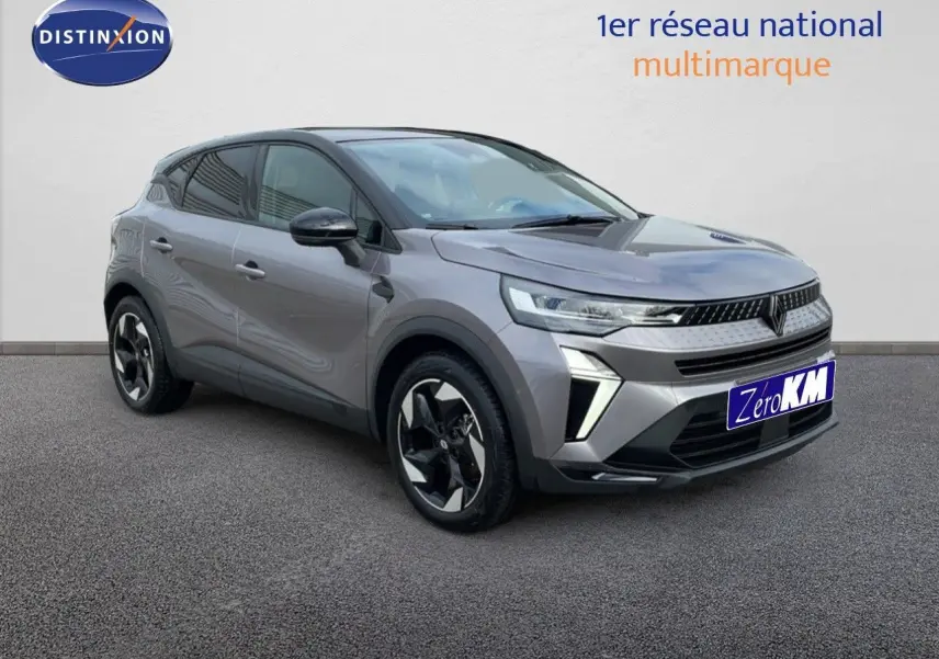Renault Captur E-Tech hybride gris Cassiopée toit noir, vue 3/4 avant droit avec jantes noires et argentées.