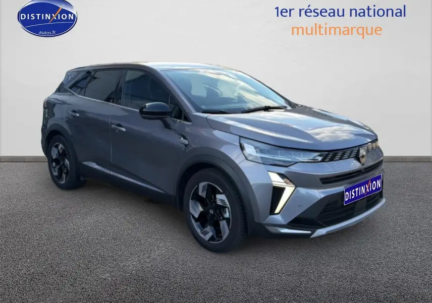 Vue 3/4 avant droit d'un Renault Symbioz gris métallisé avec calandre moderne et jantes au design géométrique.