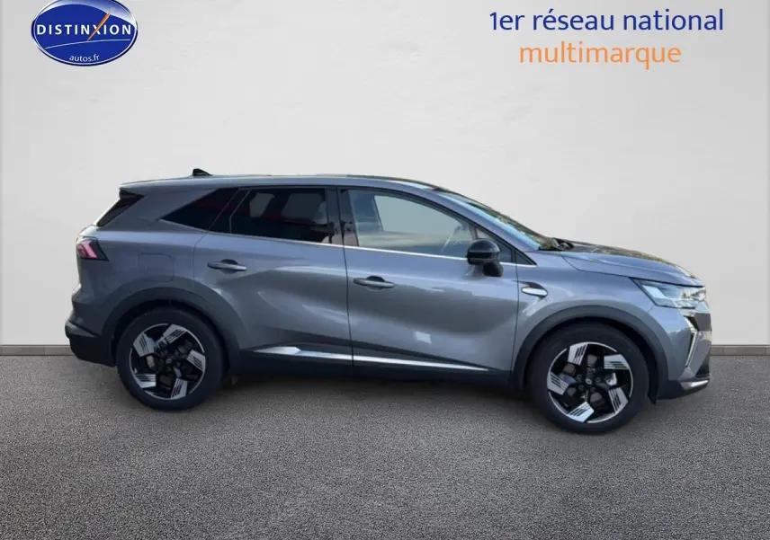 Profil droit du Renault Symbioz 2025 gris métallisé avec jantes noires et vitres arrière surteintées.