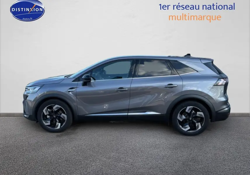 Profil droit d'un Renault Symbioz gris métallisé 2025 avec jantes noires et vitres arrière surteintées.