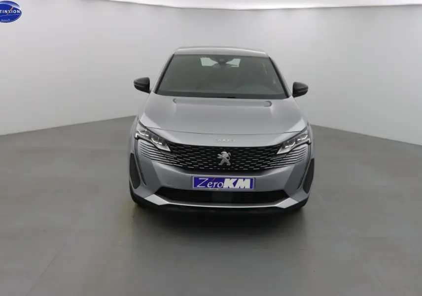 Peugeot 3008 gris Artense métal vue de face, mettant en valeur sa calandre et ses phares LED distinctifs.