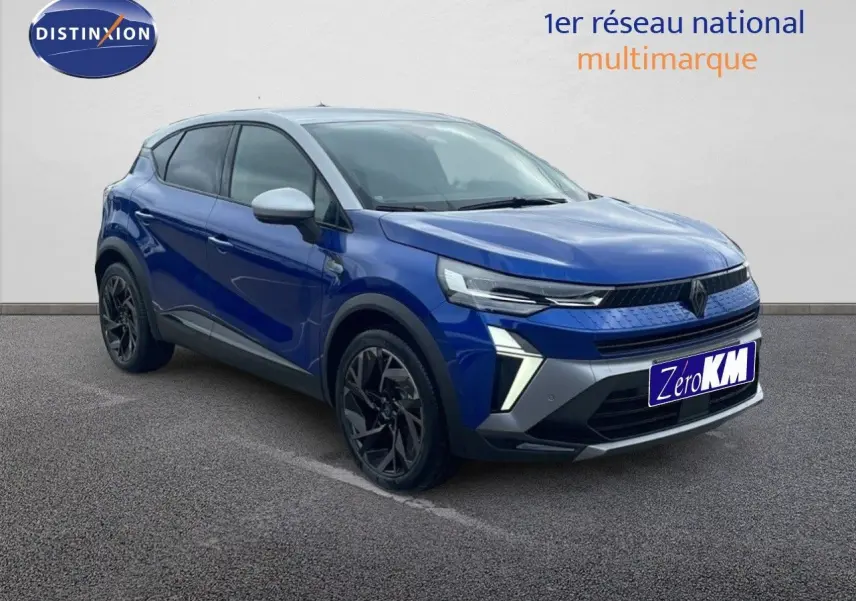 Renault Captur E-Tech hybride 2025 bleu Iron Metal avec toit gris, vue 3/4 avant mettant en valeur ses optiques LED.
