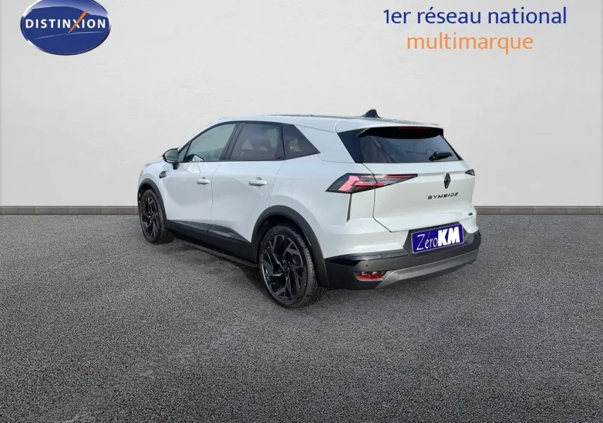 Vue 3/4 arrière droite du Renault Symbioz gris rafale avec jantes noires et feux arrière LED distinctifs.