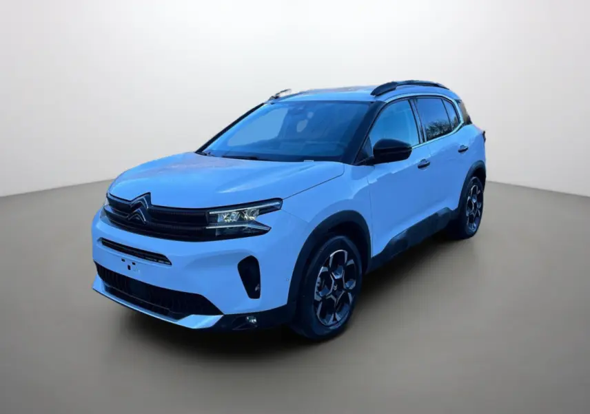 Citroën C5 Aircross Hybrid blanc okénite en 3/4 avant droit, avec barres de toit noires et jantes alu 18 pouces.