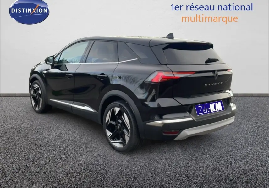 Renault Symbioz noir étoile métal en 3/4 arrière droit, SUV hybride avec feux LED distinctifs et jantes bicolores.