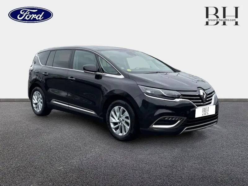 Renault Espace noir étoilé en 3/4 avant droit, avec jantes alu et signature lumineuse LED distinctive.