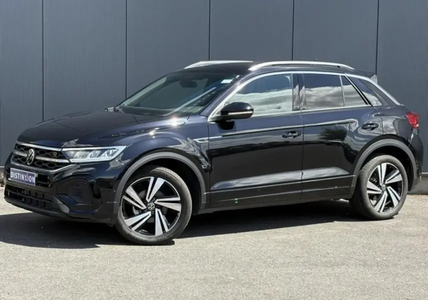 Volkswagen T-Roc noir intense en vue de profil côté gauche, avec jantes alliage 18" Nevada et détails R-Line visibles.