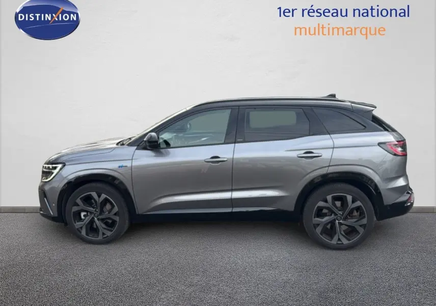 Renault Austral gris schiste avec toit noir, vue profil côté gauche, jantes noires distinctives.
