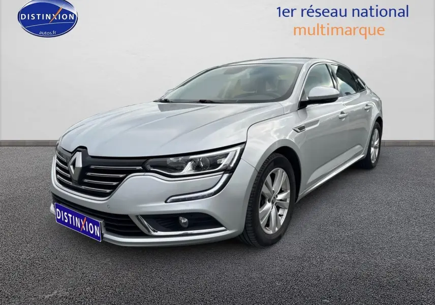 Renault Talisman gris alu vue 3/4 avant droit avec calandre chromée et phares LED distinctifs.