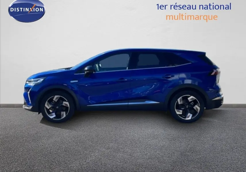 Renault Symbioz 2025 bleu Iron Metal en profil droit, SUV hybride avec jantes bicolores et lignes dynamiques.