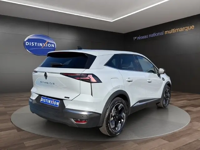 Vue 3/4 arrière droite du Renault SYMBIOZ gris clair 2025, soulignant ses feux LED et jantes noires distinctives.