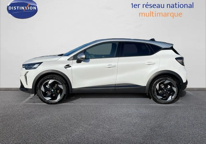 Profil côté gauche d'un Renault Captur E-Tech hybride 2025 blanc nacré avec toit gris et jantes noires distinctives.