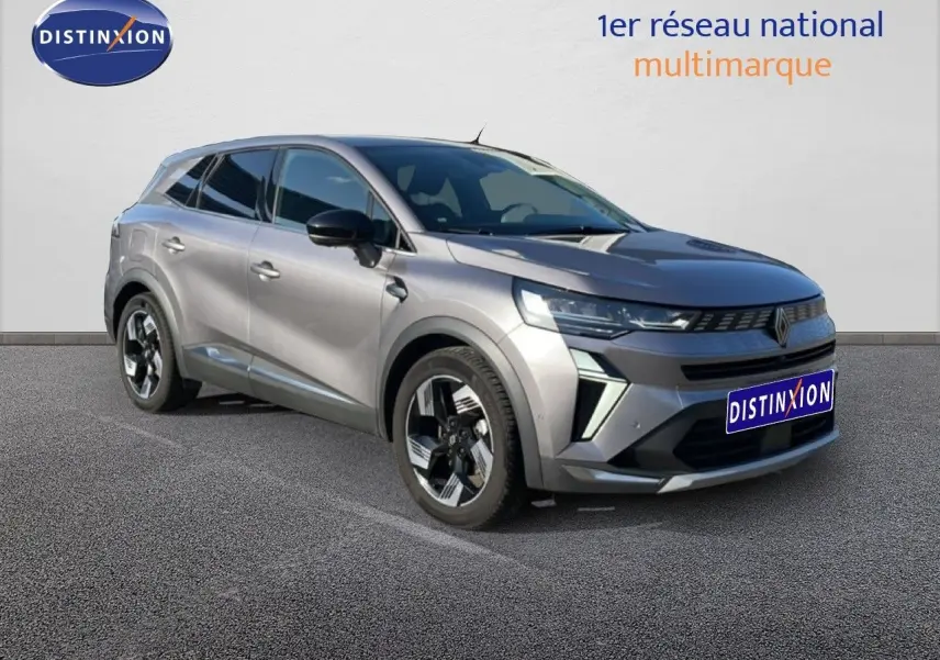Renault Symbioz gris cassiopée métal en 3/4 avant droit, avec calandre distinctive et jantes modernes.