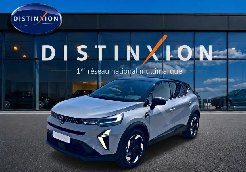 Renault Captur 2026 gris Rafale toit noir, vue 3/4 avant droit devant showroom Distinxion.