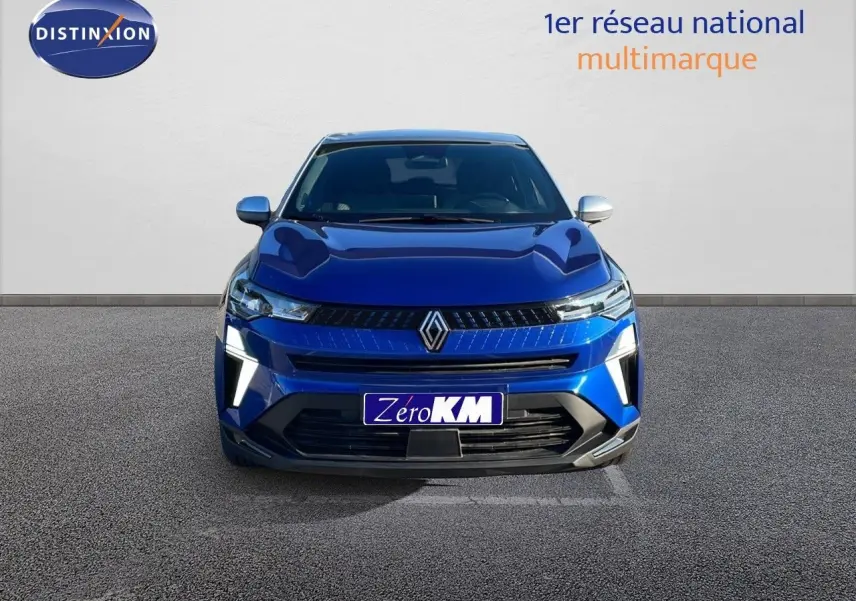 Renault Captur E-Tech hybride bleu Iron métal, vue frontale avec toit gris et éclairage LED distinctif.