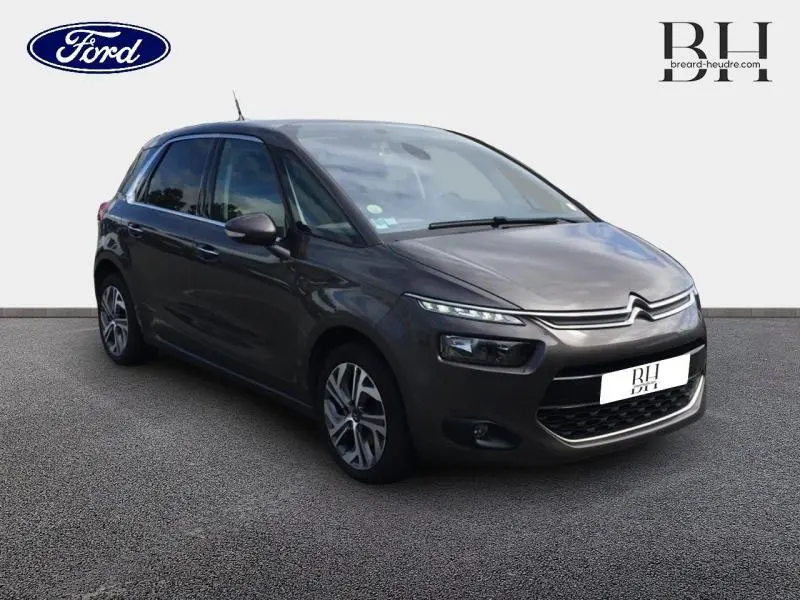 Citroën C4 Picasso gris Shark vue 3/4 avant droit avec phares LED et jantes alliage.
