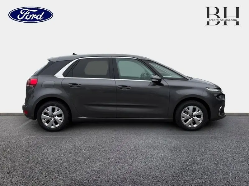 Vue latérale droite d'une Citroën C4 Spacetourer 2020 gris Platinium avec jantes alu et vitres teintées.