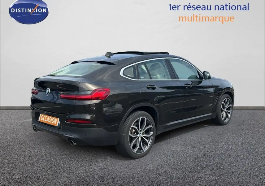 BMW X4 XDRIVE 30D 2019 en Sparkling Storm Métal, vue 3/4 arrière droit avec jantes alliage et feux LED.