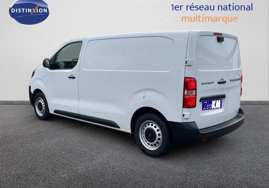 Peugeot Expert Fourgon blanc icy vu de trois quarts arrière droit, avec portes arrière fermées et jantes acier simples.