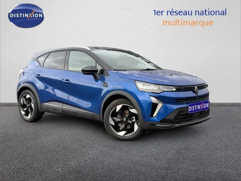 Renault Captur 2025 bleu Iron/Noir Etoilé en vue 3/4 avant droit, avec jantes noires et détails modernes distinctifs.