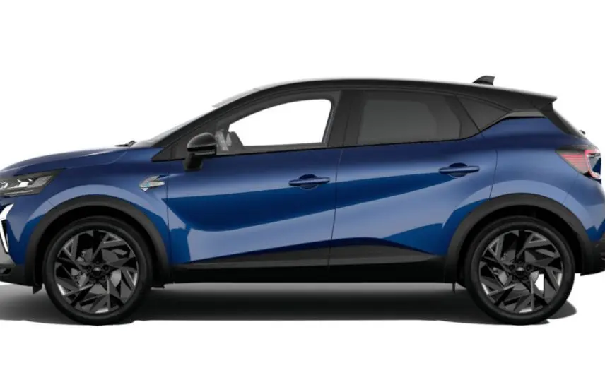 Profil droit du Renault Captur 2025 bleu Iron avec toit noir étoilé et jantes noires distinctives.
