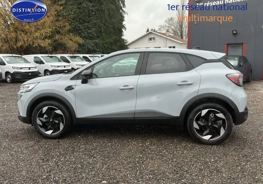 Profil côté gauche du Renault Captur gris rafale 2026 avec jantes alliage noires et toit noir contrasté.