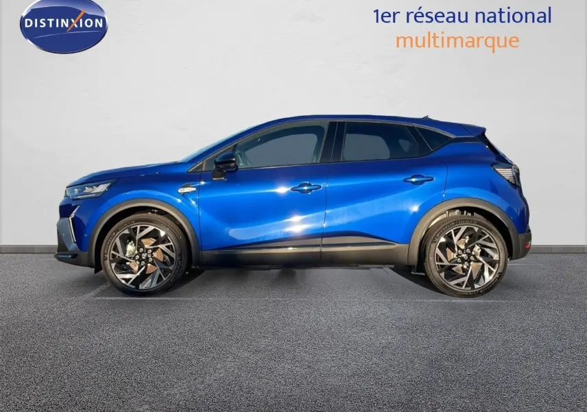 Profil côté gauche du Renault Captur E-Tech hybride 2025 en bleu Iron Metal avec jantes alliage bicolores.