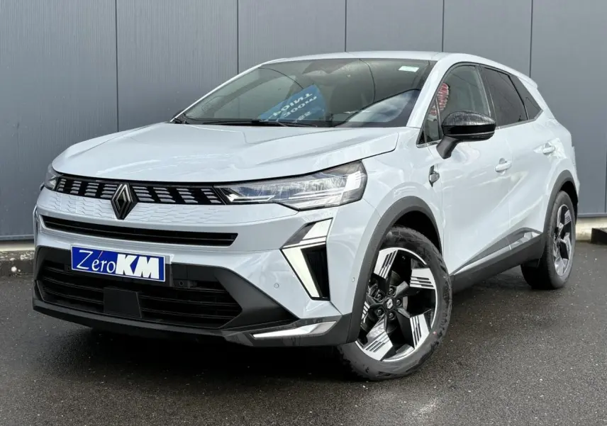 Renault Symbioz gris Rafale en 3/4 avant droit, avec jantes noires et blanches et calandre moderne noire.