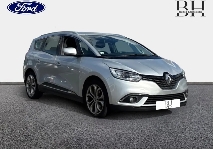 Renault Grand Scenic gris platine en 3/4 avant droit, avec jantes alliage et feux LED visibles.