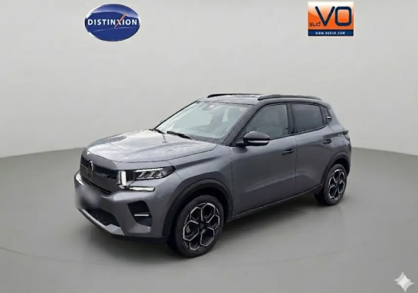 Citroën C3 Turbo 100 ch gris vue 3/4 avant droit avec jantes alliage et barres de toit visibles.