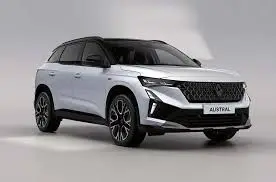 Renault Austral Ph.2 blanc perle toit noir, vue 3/4 avant, mettant en valeur ses optiques LED et sa calandre distinctive.