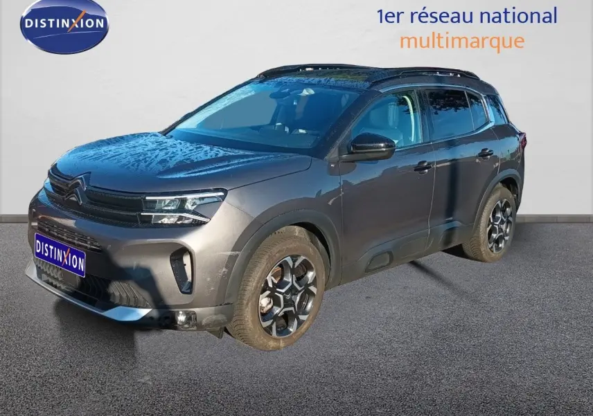 Citroën C5 Aircross gris platinium métal en 3/4 avant droit, avec jantes alliage et toit noir contrasté.