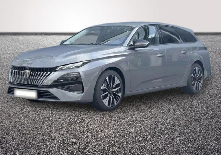 Peugeot 308 Hybrid gris foncé vue 3/4 avant, avec calandre verticale et jantes bicolores distinctives.