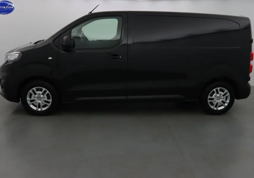 Profil droit d'un Peugeot Expert Fourgon noir métal 2022, finition Premium, avec jantes argentées et porte latérale coulissante.