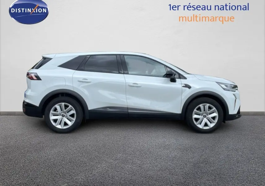 Profil droit du Renault SYMBIOZ blanc nacré, SUV hybride 2025 avec jantes alliage et lignes modernes.