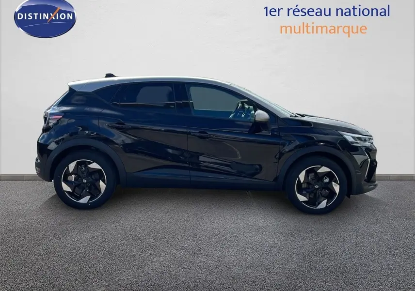Profil droit du Renault Captur 2025 noir étoile métal avec toit gris, jantes biton et lignes modernes distinctives.