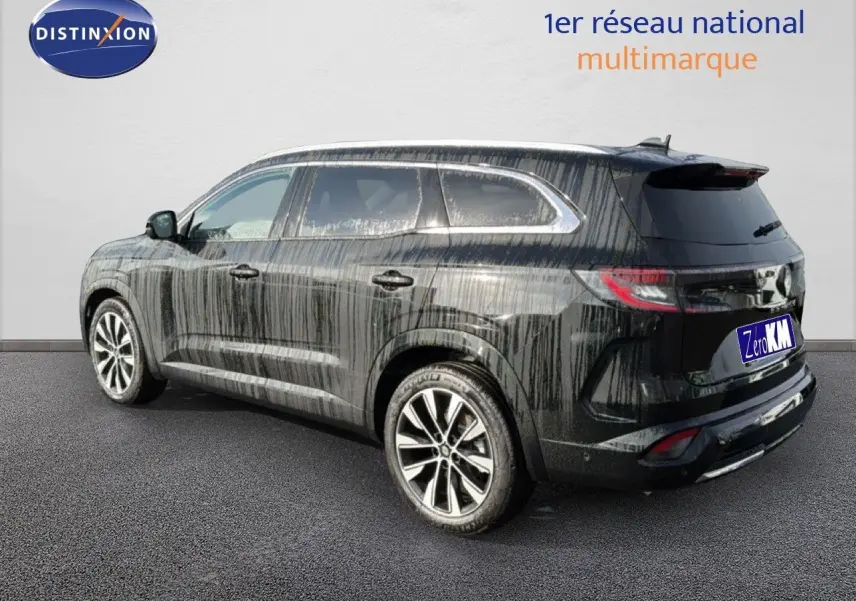 Renault Espace noir étoile métal vu de trois quarts arrière droit, SUV familial avec jantes alliage et vitres teintées.
