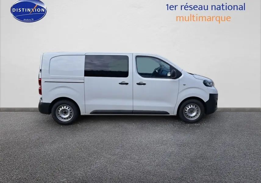 Peugeot Expert Blanc Kaolin vu de profil côté droit, fourgon utilitaire avec vitres teintées arrière.