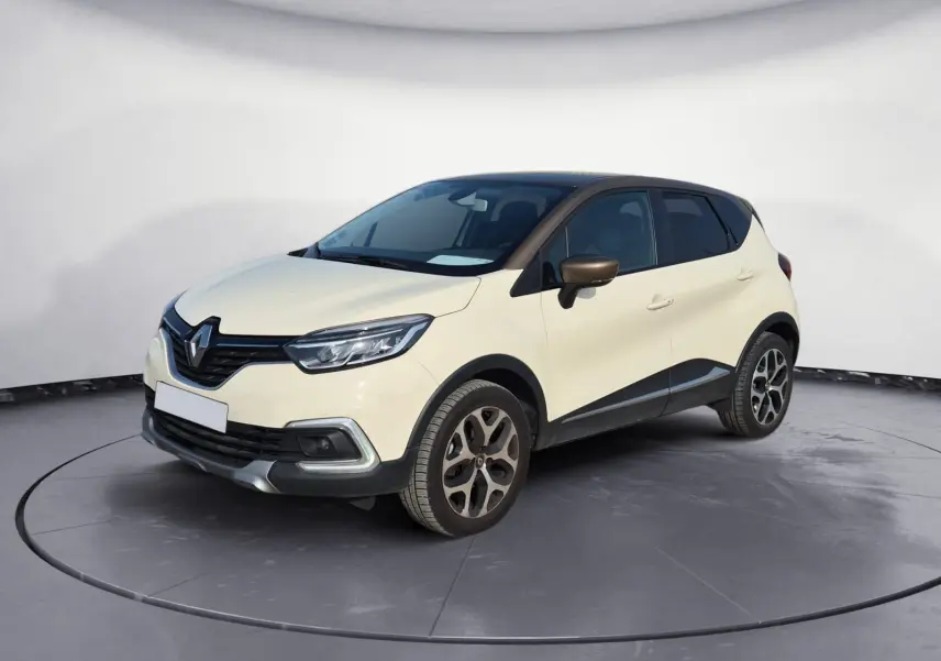 Renault Captur beige et marron en 3/4 avant droit, avec jantes alliage et toit foncé contrastant.