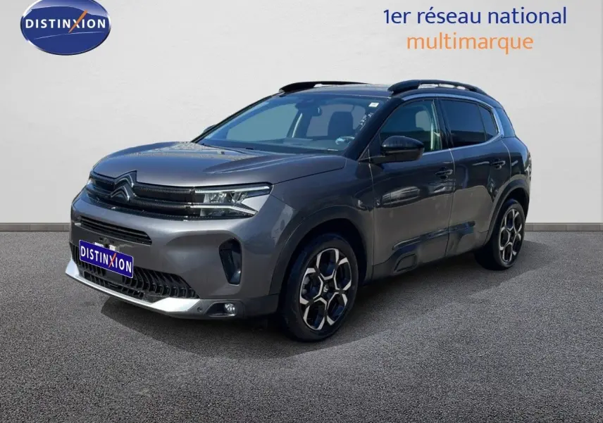 Citroën C5 Aircross gris platinium métal en 3/4 avant droit, SUV hybride essence avec jantes bi-ton distinctives.