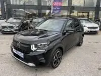 Citroën C3 1.2 turbo 100 cv noir vue 3/4 avant, avec calandre distinctive et jantes noires, stationnée en extérieur.