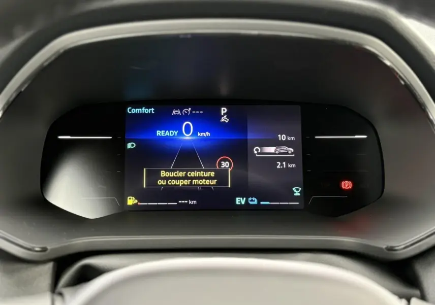 Tableau de bord numérique du Renault Captur 2026 affichant la vitesse à 0 km/h et un message de sécurité.