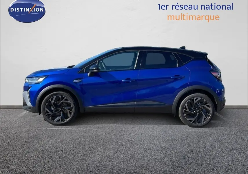 Profil droit du Renault Captur E-Tech hybride 2025 en bleu Iron Metal avec toit noir et jantes noires.