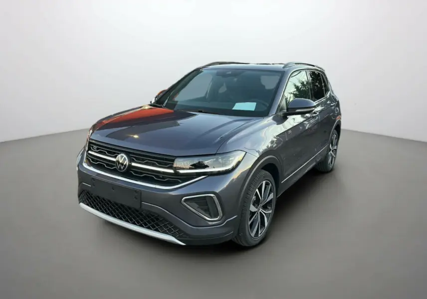 Volkswagen T-Cross TSI 116 DSG7 R-Line gris cendré en 3/4 avant avec jantes alu 18 pouces et barres de toit.