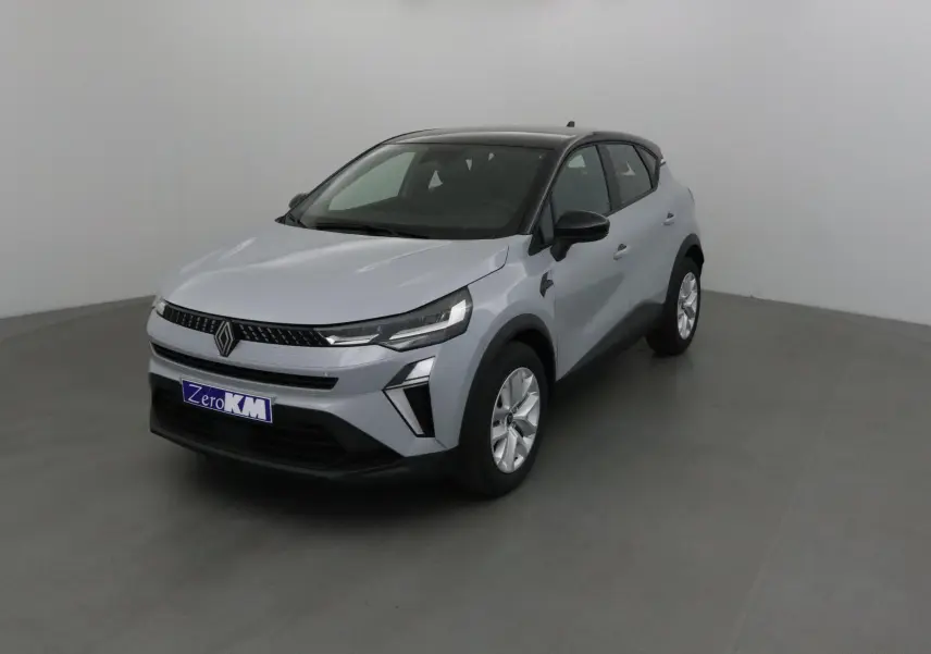 Renault Captur 2025 gris Rafale avec toit noir, vue 3/4 avant droit dans un studio neutre.